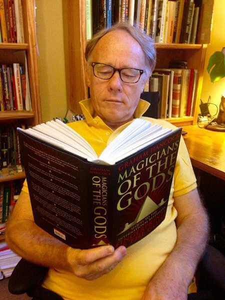 Graham Hancock holds the first print of “Magicians of the Gods.” Image Credit: Twitter