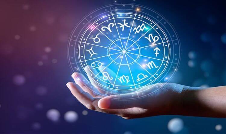 Hand Holding Astrology Chart