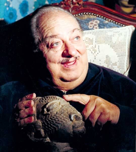 One of the few pictures available of Angelo Pitoni with a Nomoli figure from the tribe who gave him Sky Stones