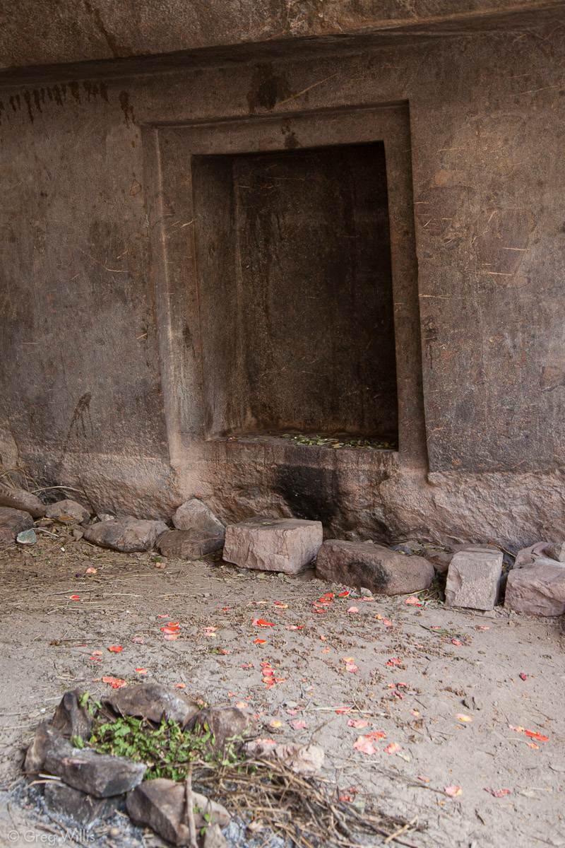 The rock cut doorway that in the old Andean traditions would have served for the Naupa to cross into our world from other spaces. Some offerings and candles have been placed on the threshold by local shamans ©Greg Willis