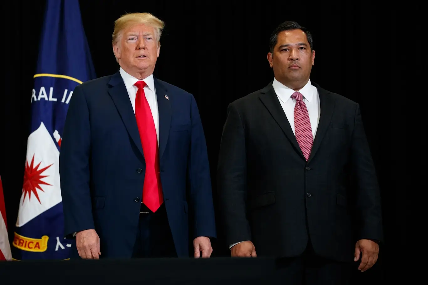 Trump stands with then-CIA Chief Operations Officer Brian Bulatao at CIA Headquarters, May 21, 2018, in Langley, Va. Evan Vucci | AP