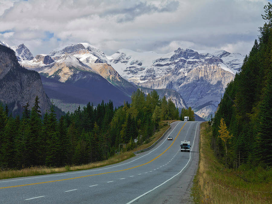 The Trans-Canada Highway runs near Banff National Park in Canada, with massive Mt. Bourgeau standing majestically in the background. SEAN XU/SHUTTERSTOCK