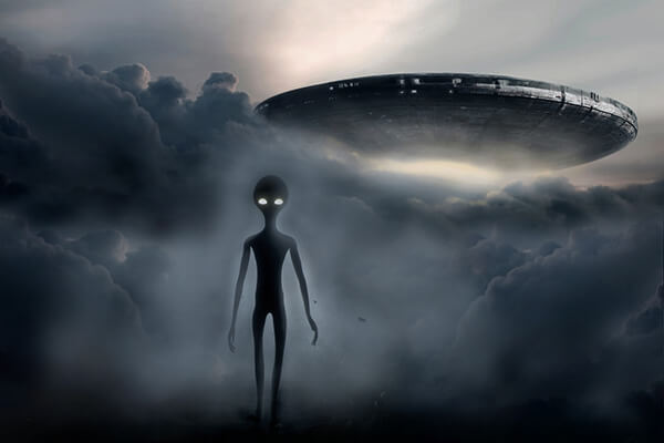 Grey alien and UFO