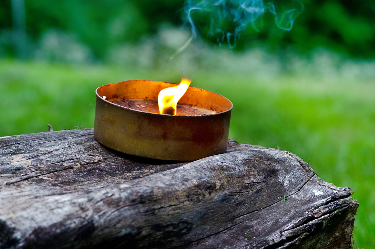Image of a Citronella Candle burning.
