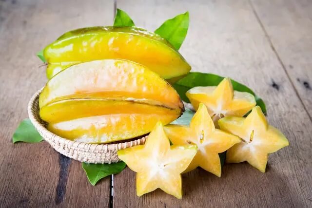 Star fruit on wood background, starfruit on wood background