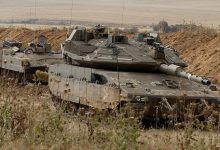 Israeli tanks are stationed along the Israel-Gaza border.