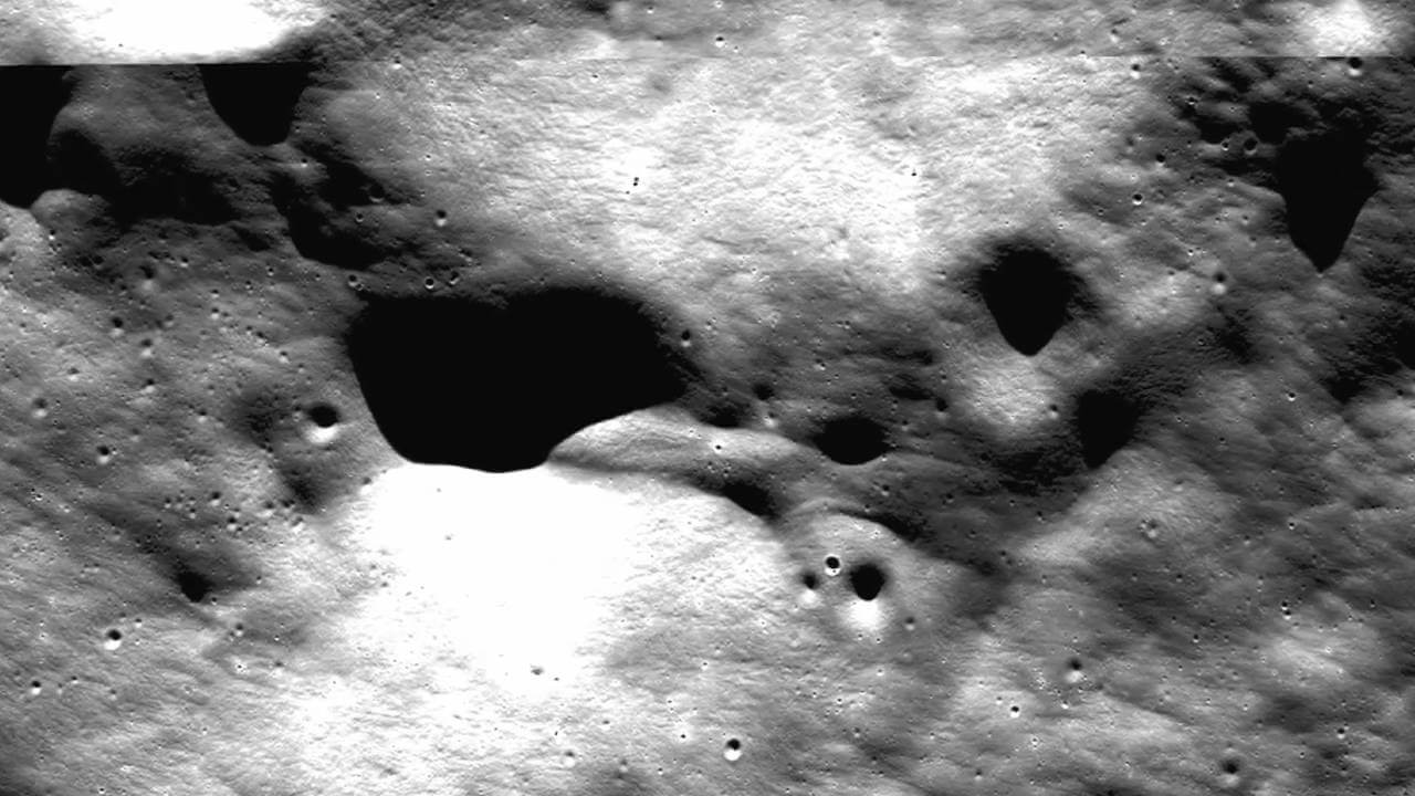 The alien Spaceship on the Moon is estimated to be 11056 ft (3,370 meters) long: