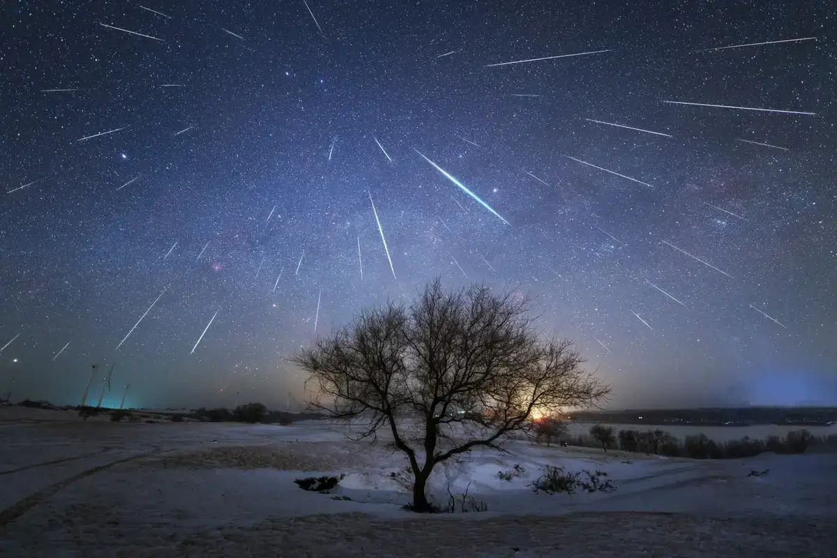 The Geminid meteor shower over Jade Dragon Snow Mountain in China