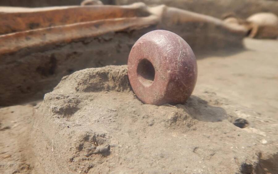 A bead unearthed in the cemetery. 