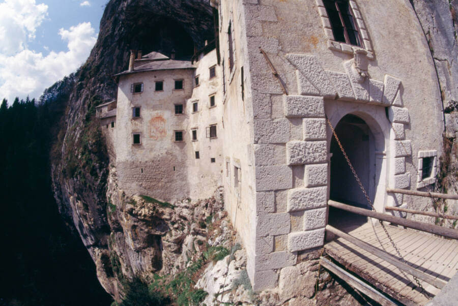 Entrance way to Predjama Castle, nestled within the large cave and overlooking a steep cliff. 