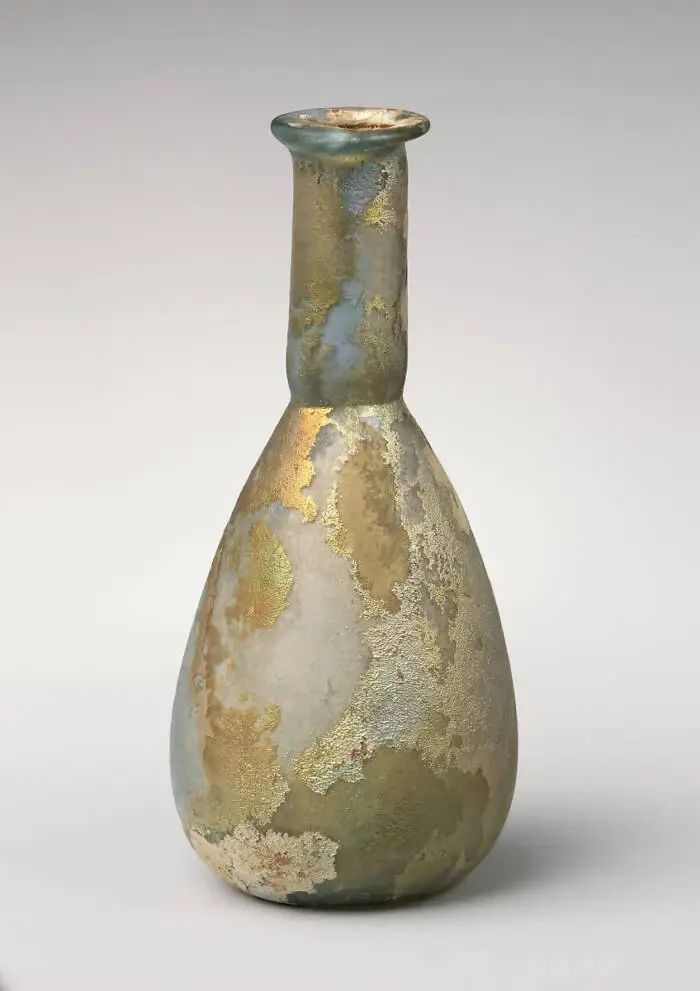 A Roman perfume bottle from the first century C.E. A Roman ligula could have been used to extract perfume from a long-necked bottle like this one. 