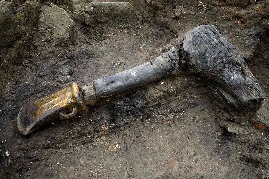 Archaeologists uncovered a trove of artifacts, including this scorched axe, from a Bronze Age settlement called Must Farm.
