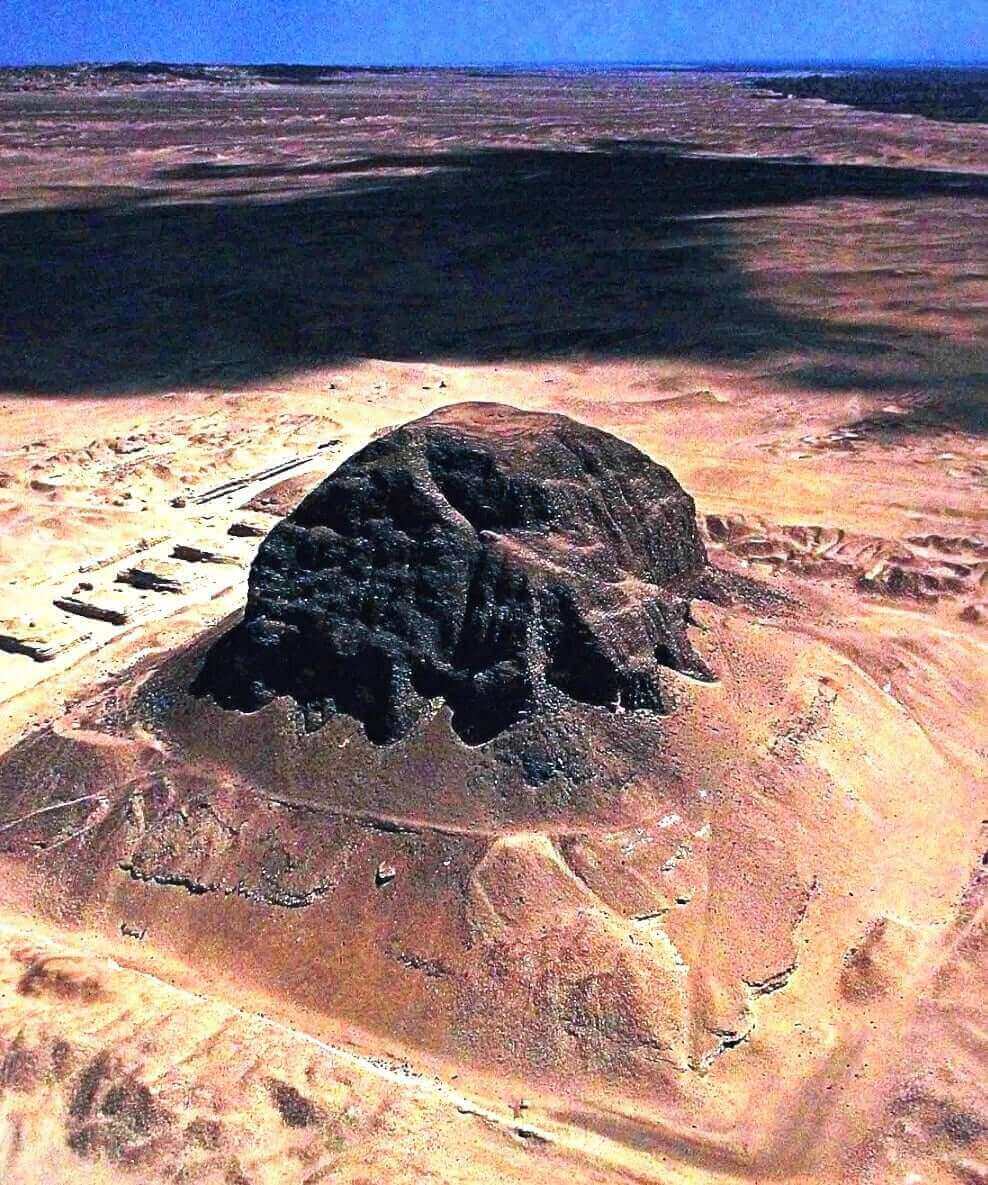 Ancient Black Pyramid of Amenemhet III in Egypt, crumbling with age, shrouded in mystery and history.