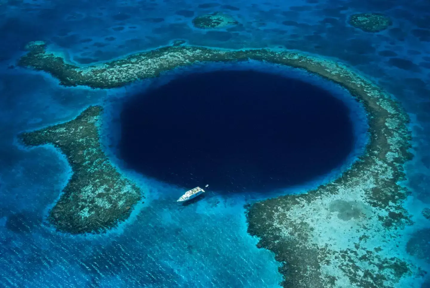 The Great Blue Hole is approximately 60 miles from Belize (Schafer & Hill/Getty)