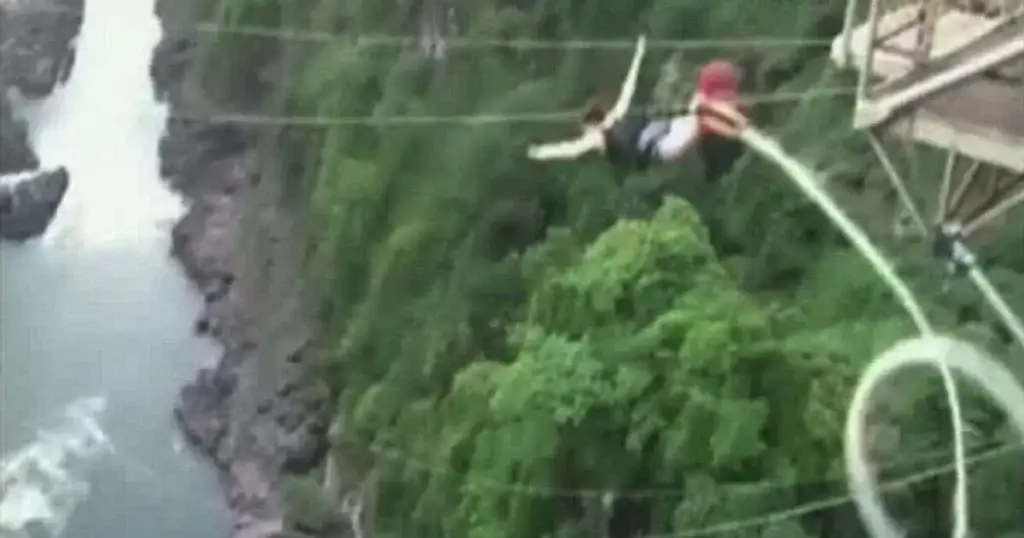 Woman fell 360ft into crocodile-infested water after her bungee cord snapped.