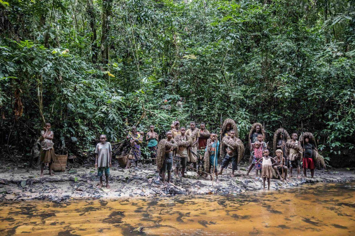 Indigenous people in Congo near unexplored forest.