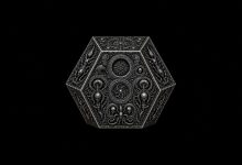 Ornate silver alien artifact with symmetrical engraved geometric designs