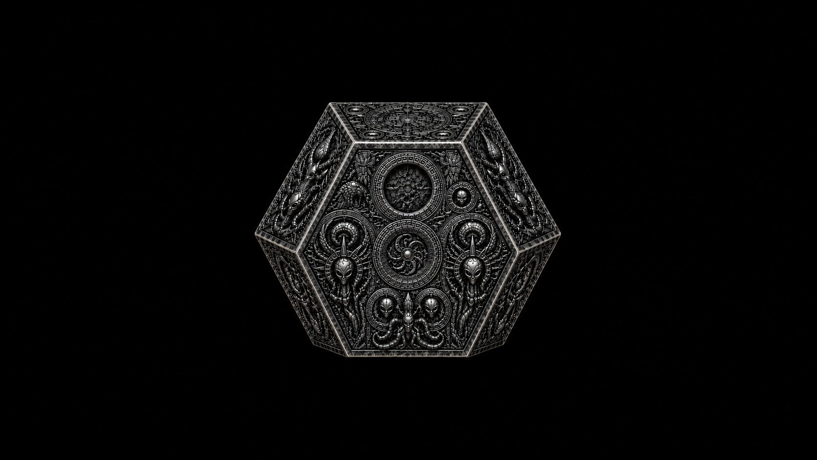 Ornate silver alien artifact with symmetrical engraved geometric designs